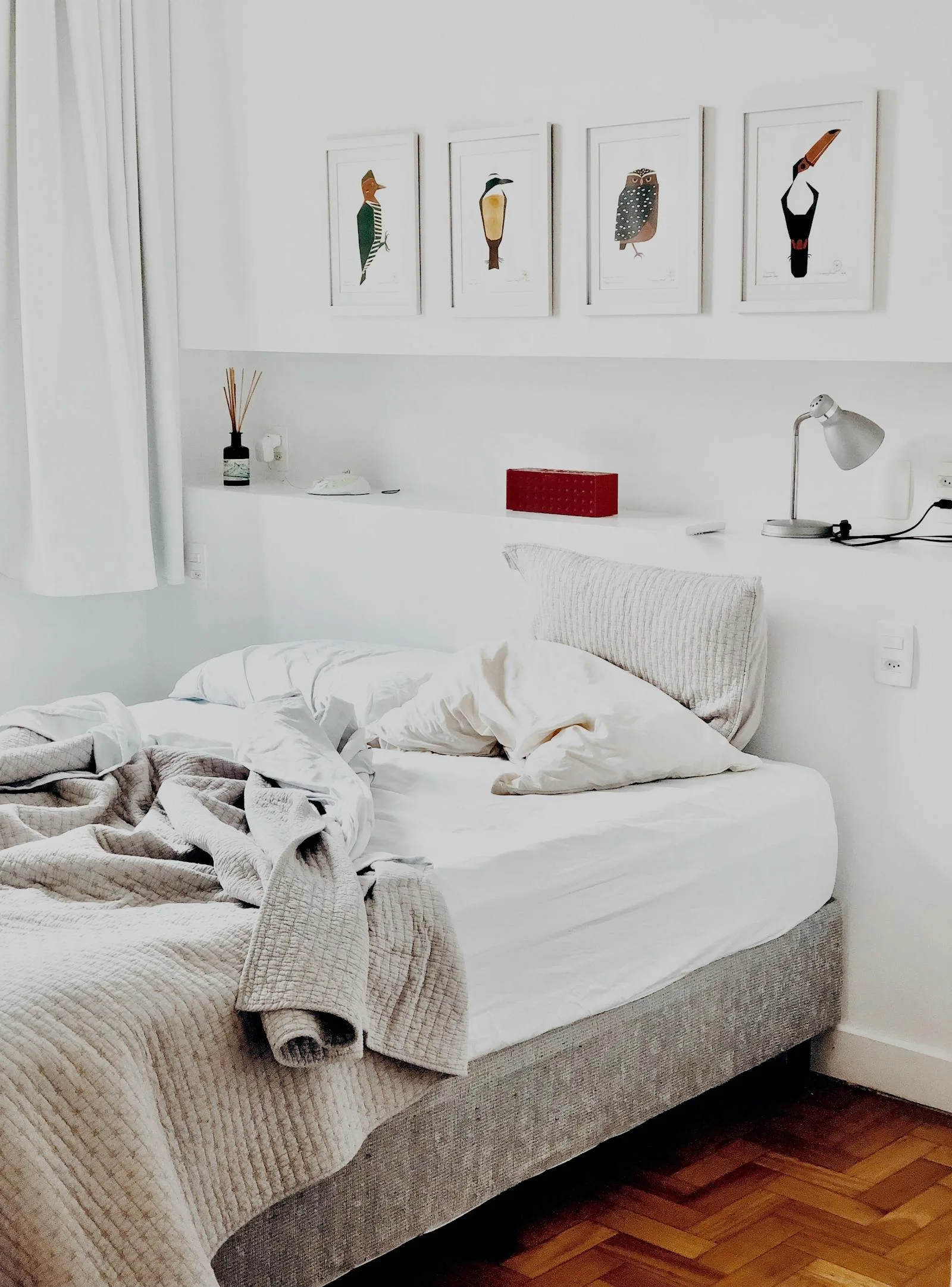 Minimalist bedroom with artwork series