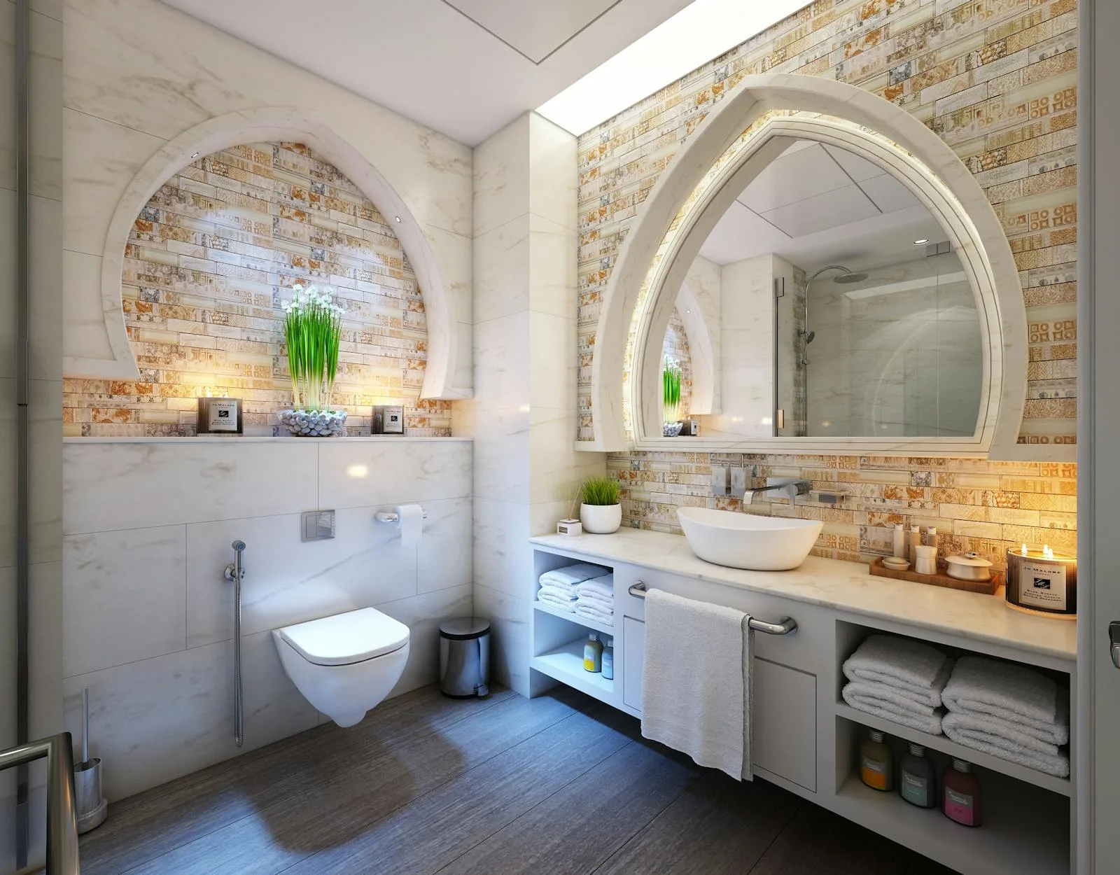 Luxury bathroom with ornate mirror and stone feature
